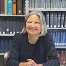 Dr. Elisabeth Krimmer smiles in the German library.