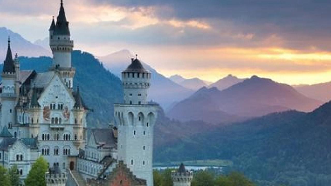 A landscape photo of a castle near dawn