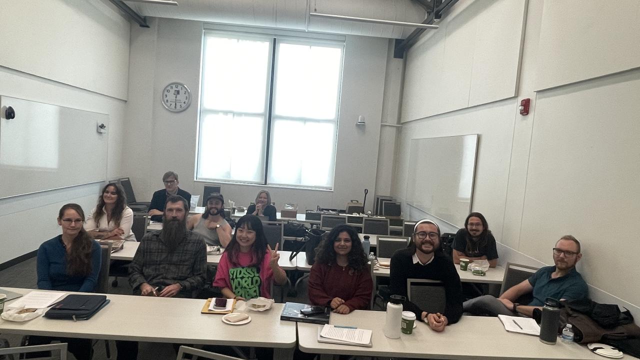 A photo of grad students in a classroom